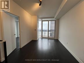 Toronto (Mount Pleasant West) condo for rent - A spacious room with a sliding glass door leading to a balcony.