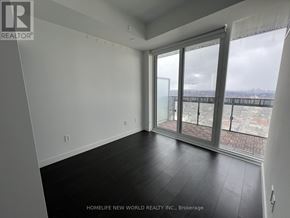 Toronto (Mount Pleasant West) condo for rent - A room with a large window and sliding glass doors.