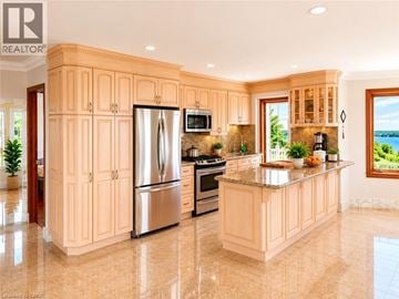 Hamilton apartment for rent - A kitchen with wooden cabinets and a marble floor.