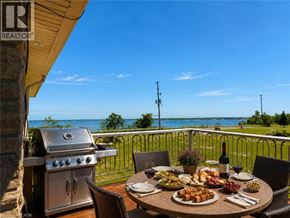 Hamilton apartment for rent - A table with food and drinks on it with a view of the water.