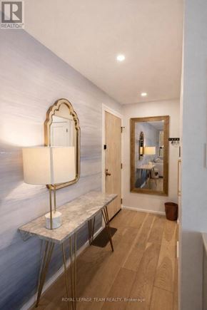 Ottawa condo for rent - A well-lit room with a table, chair, and a framed picture on the wall.