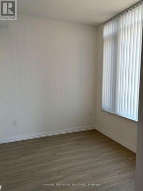 Toronto (Mount Pleasant West) condo for rent - A room with a window and wooden flooring.