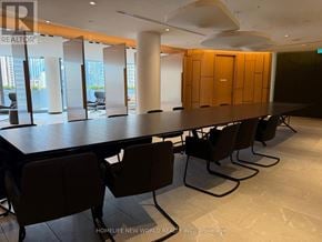 Toronto (Bay Street Corridor) condo for rent - A conference room with a long table and chairs.