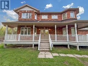Georgina (Keswick South) apartment for rent - A two-story house with a porch and a front yard.