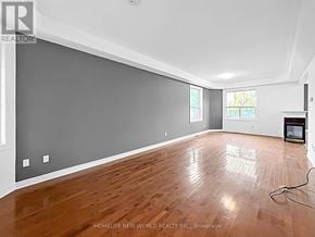 Georgina (Keswick South) apartment for rent - A room with wooden flooring and a grey wall.