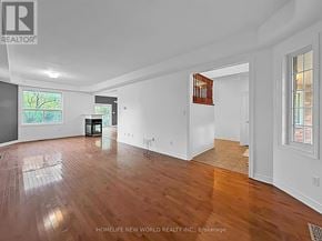 Georgina (Keswick South) apartment for rent - A spacious room with wooden floors and white walls.