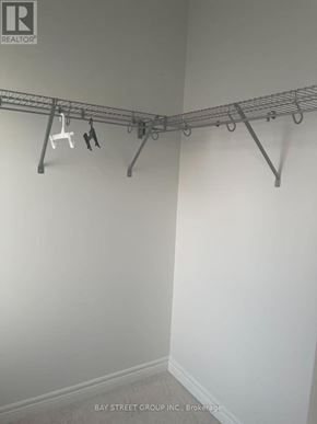 Georgina (Keswick South) apartment for rent - A white wall with a clothes drying rack.