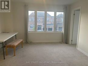 Georgina (Keswick South) apartment for rent - A room with a table and a bench in front of a window with a view of a building.