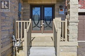 Thorold (Thorold Downtown) townhouse for rent - A brown door with a glass window and a metal handle.