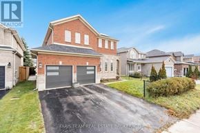 Barrie (Innis-Shore) apartment for rent - A large brick house with a driveway in front of it.