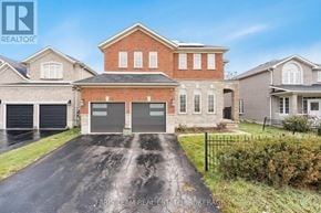 Barrie (Innis-Shore) apartment for rent - A large brick house with a driveway in front.