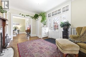 Pembroke apartment for rent - A living room with a rug, a couch, and a potted plant.