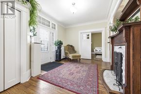 Pembroke apartment for rent - A living room with a red rug and a fireplace.