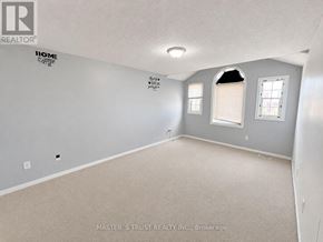 Kitchener apartment for rent - A room with a carpet floor and a window with blinds.