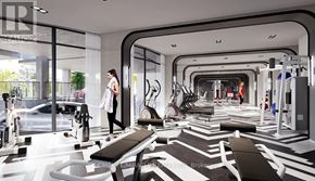 Toronto (Yorkdale-Glen Park) condo for rent - A woman is walking through a modern gym with a variety of exercise equipment.