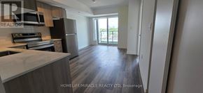 Toronto (Yorkdale-Glen Park) condo for rent - A modern living room with a reception desk and a large mirror.