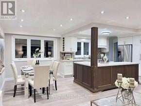 Whitchurch-Stouffville (Stouffville) apartment for rent - A well-lit kitchen with a dining table set for four.