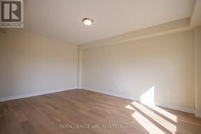 Thorold (Rolling Meadows) apartment for rent - A room with wooden flooring and a light on the ceiling.