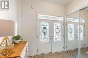Milton (Bw Bowes) apartment for rent - A white door with a glass window is in the middle of a room.