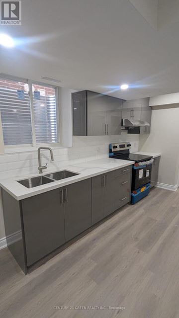 Milton (Bw Bowes) apartment for rent - A kitchen with a sink and cabinets.