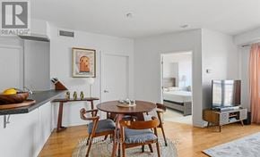 Ottawa condo for rent - A dining room with a wooden table and chairs.