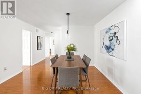 Toronto (Don Valley Village) condo for rent - A dining room with a wooden table and chairs.