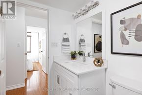 Toronto (Don Valley Village) condo for rent - A bathroom with a white sink and a white tub.
