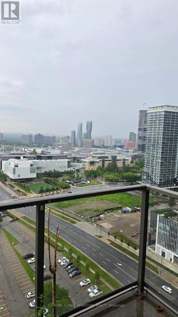 Mississauga (City Centre) condo for rent - A cityscape with tall buildings and a cloudy sky.