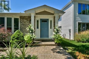 Oakville (Oo Old Oakville) apartment for rent - A house with a blue door and a brick walkway in front.