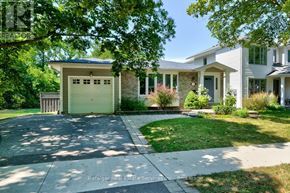 Oakville (Oo Old Oakville) apartment for rent - A house with a white garage door is for sale.