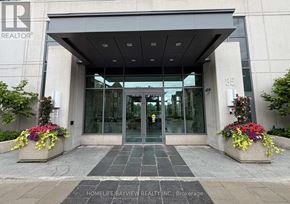 Toronto (Thorncliffe Park) condo for rent - The entrance to a building with a glass door and a sign that reads "REALTOR".