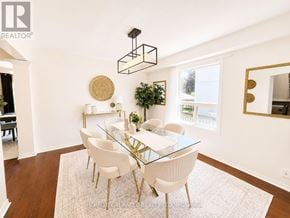 Oshawa (Pinecrest) apartment for rent - A dining room with a glass table and white chairs.