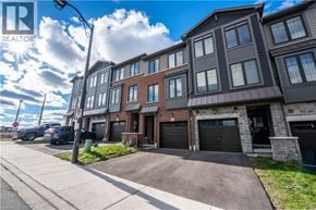 Cambridge townhouse for rent - A row of townhouses with a REALTOR® logo in the corner.
