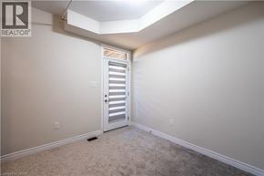 Cambridge townhouse for rent - A room with a white door and carpeted floor.
