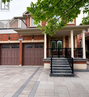 Oakville (Wm Westmount) apartment for rent - A house with a black metal railing on the front porch.