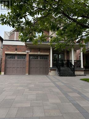 Oakville (Wm Westmount) apartment for rent - A brick house with a black garage door and a black staircase.