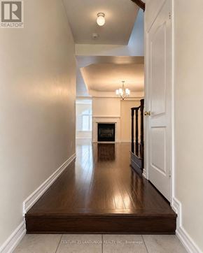 Oakville (Wm Westmount) apartment for rent - A hallway with a wooden floor and white walls.