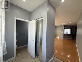 Brampton (Northwest Brampton) apartment for rent - A room with a white door and a mirror on the wall.