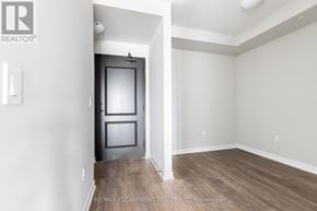 Hamilton (Stoney Creek) condo for rent - A room with a door and a window.