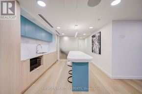 Mississauga (Cooksville) condo for rent - A realtor office with a counter and a framed picture on the wall.