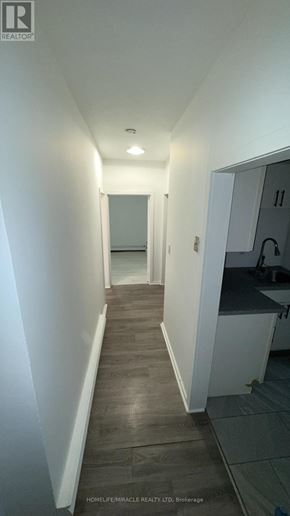 Cambridge apartment for rent - A long hallway with a door on the right.