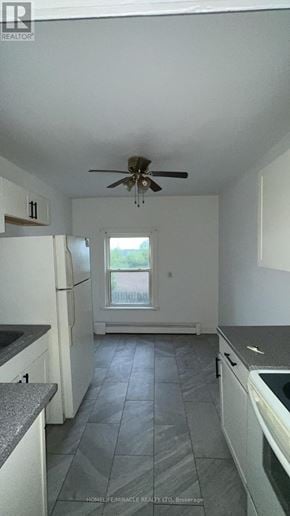 Cambridge apartment for rent - A kitchen with a fan on the ceiling and a window.