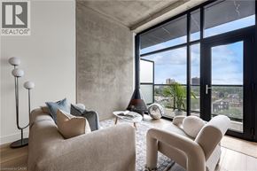 Hamilton apartment for rent - A living room with a large window overlooking a cityscape.