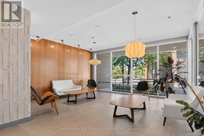 Ottawa condo for rent - A modern living room with a wooden accent wall and a variety of seating options.