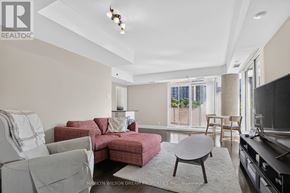 Ottawa condo for rent - A living room with a grey couch and a red couch.