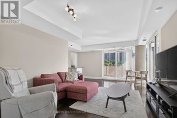 Ottawa condo for rent - A living room with a grey couch and a red couch.