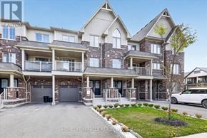 Whitby (Rolling Acres) townhouse for rent - A large, multi-level residential building with a well-maintained front yard.
