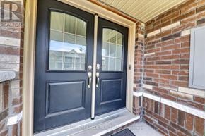 Whitby (Rolling Acres) townhouse for rent - A black double door with a glass window and a handle.