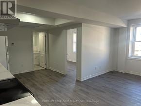 Oshawa (Central) apartment for rent - A room with a grey floor and white walls.