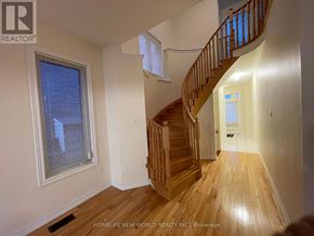 Markham (Cathedraltown) apartment for rent - A wooden staircase leads up to a second floor landing.